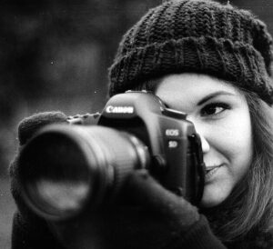 Young woman using a camera